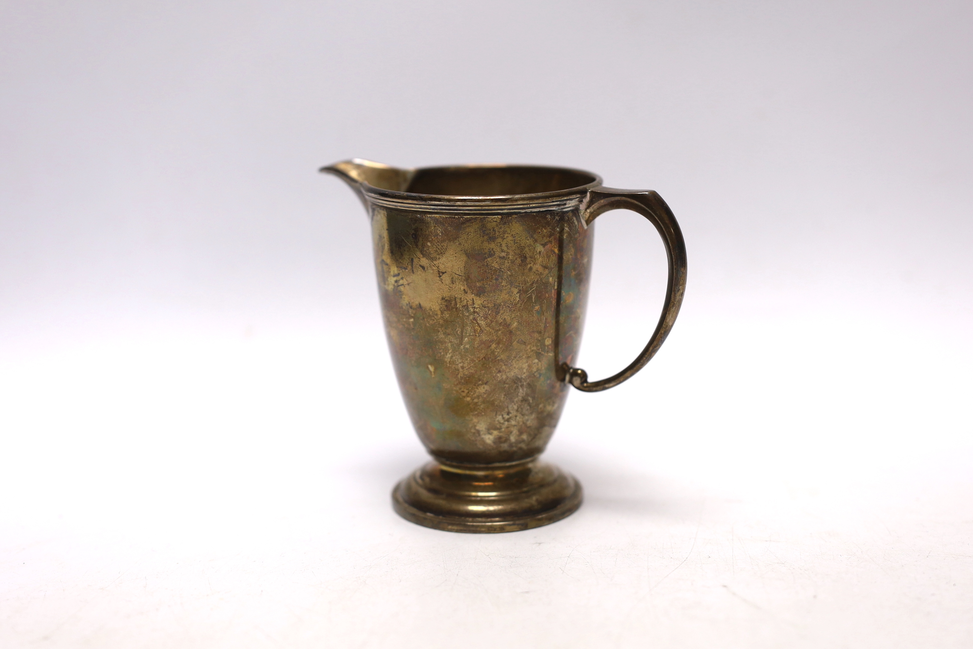 An Elizabeth II silver cream jug, Wakely & Wheeler, London, 1956, 93mm, 4.4oz.